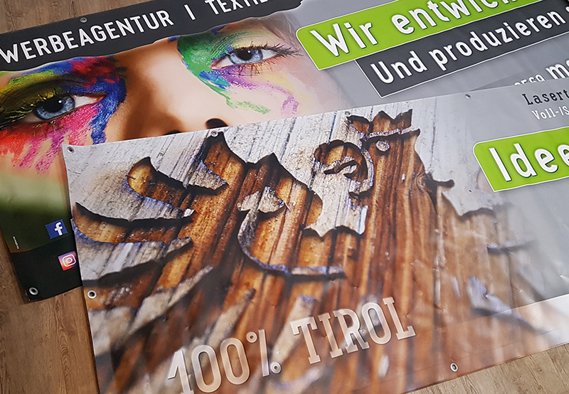 Bedruckte Werbebanner für die MG-Design Werbeagentur mit Tirol-Motiven